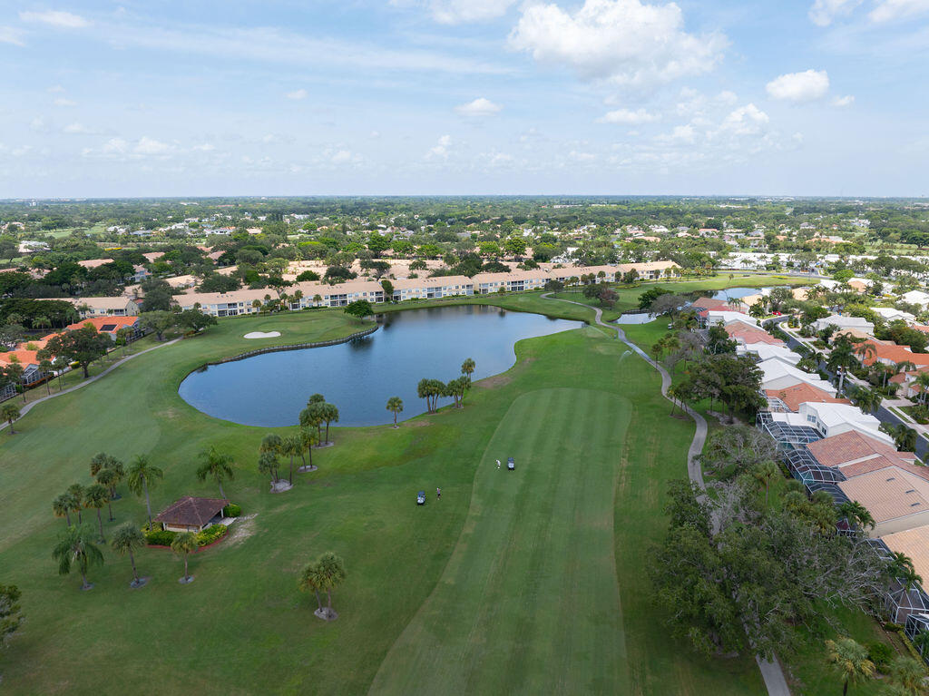 17031 Boca Club Boulevard, Unit 65A Boca Raton, FL 33487 - Photo 1 of 34 an aerial view of lake residential houses with outdoor space and trees