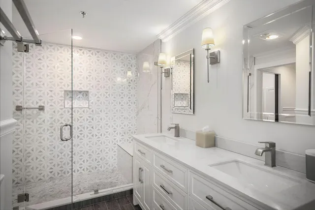 a bathroom with a shower sink and mirror