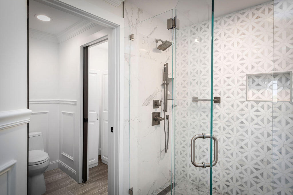 17031 Boca Club Boulevard, Unit 65A Boca Raton, FL 33487 - Photo 16 of 34 a bathroom with a shower toilet and sink