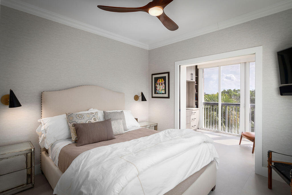 17031 Boca Club Boulevard, Unit 65A Boca Raton, FL 33487 - Photo 18 of 34 a bedroom with a large bed and a large window