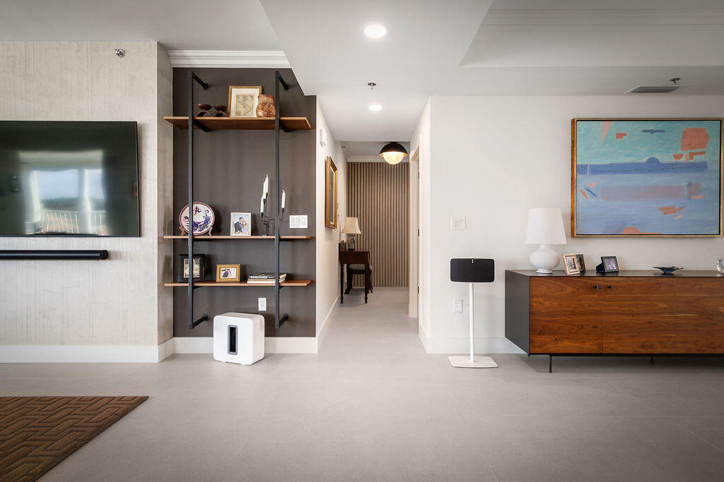 17031 Boca Club Boulevard, Unit 65A Boca Raton, FL 33487 - Photo 22 of 34 a living room with furniture and a flat screen tv