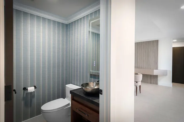 a bathroom with a toilet a sink and shower