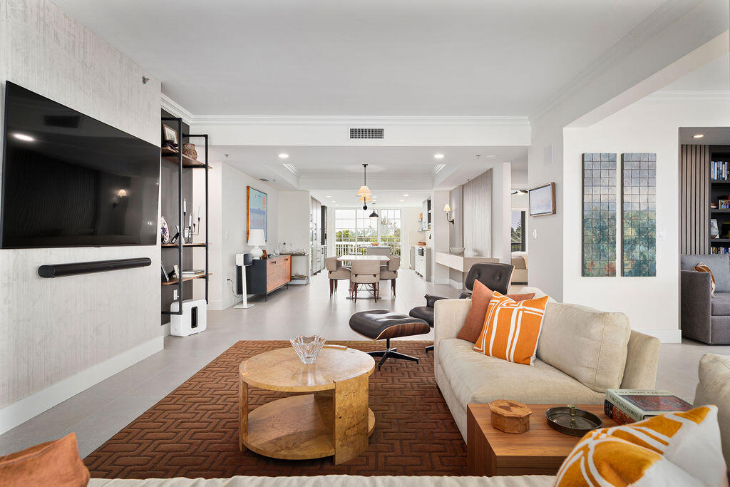 17031 Boca Club Boulevard, Unit 65A Boca Raton, FL 33487 - Photo 3 of 34 a living room with furniture and a flat screen tv