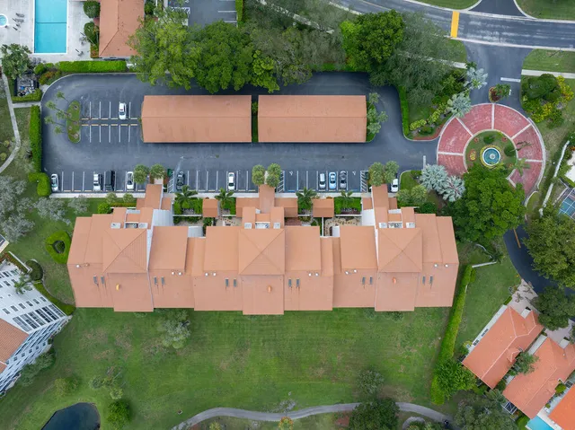 an aerial view of house with yard swimming pool and outdoor seating