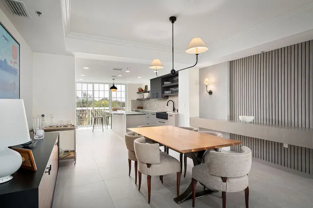 a dining room with furniture and wooden floor