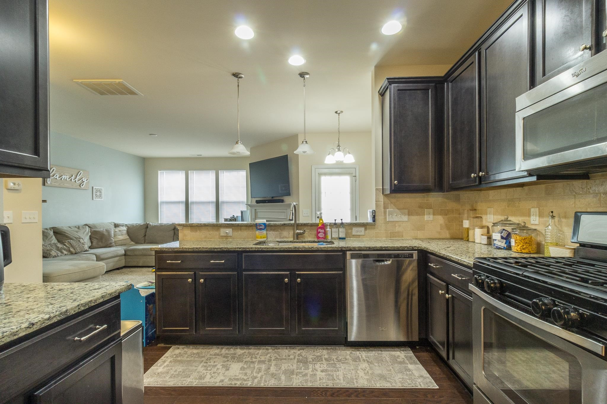 9110 Wooden Road Raleigh, NC 27617 - Photo 19 of 27 Kitchen area overlooking the breakfast area and door leading to rear deck area Kitchen