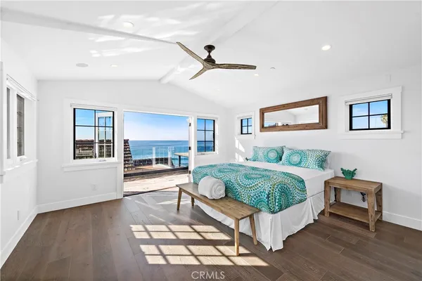 a living room with a bed furniture and a window
