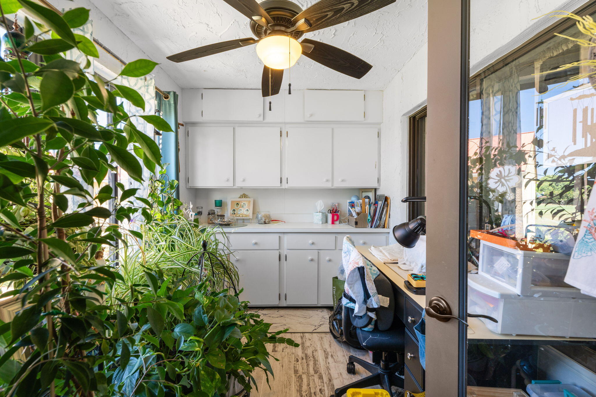 5383 Southeast Miles Grant Road, Unit B206 Stuart, FL 34997 - Photo 11 of 17 a kitchen that has a lot of white cabinets and appliances