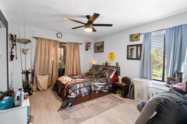 a bed room with a bed and a window