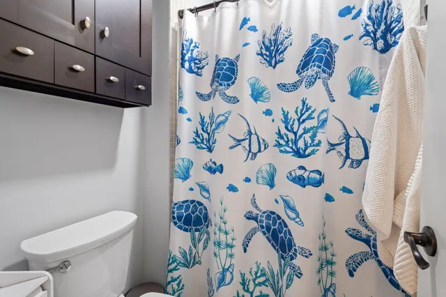 a bathroom with a bathtub and toilet