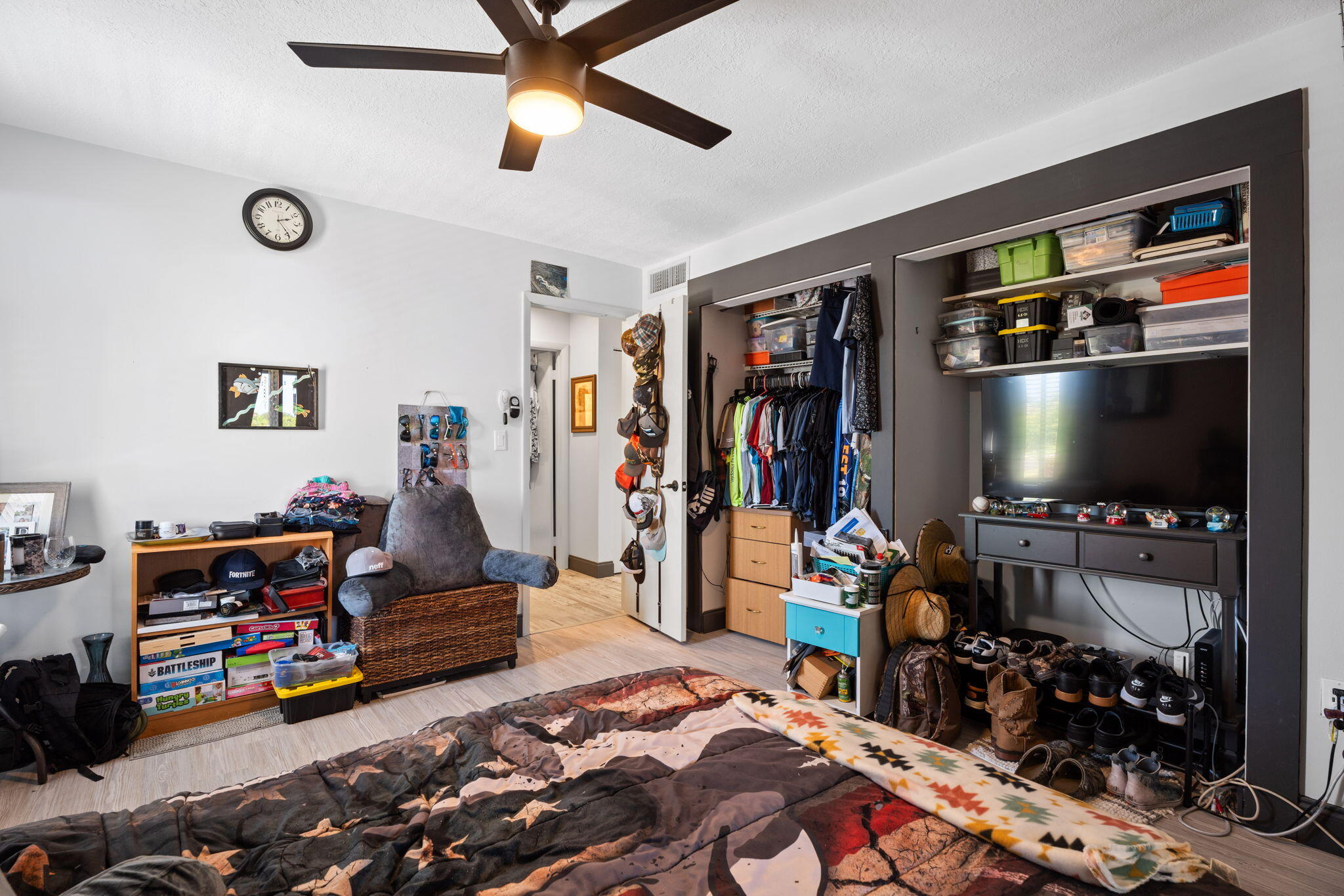 5383 Southeast Miles Grant Road, Unit B206 Stuart, FL 34997 - Photo 6 of 17 a living room with lots of furniture and a flat screen tv