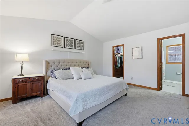 a bedroom with a bed and a night stand