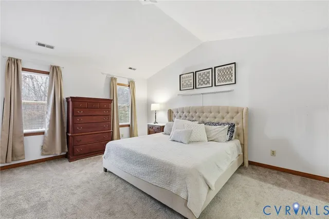a large bed sitting in a bedroom and closet