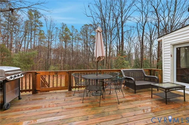 a view of a chairs and table on the patio