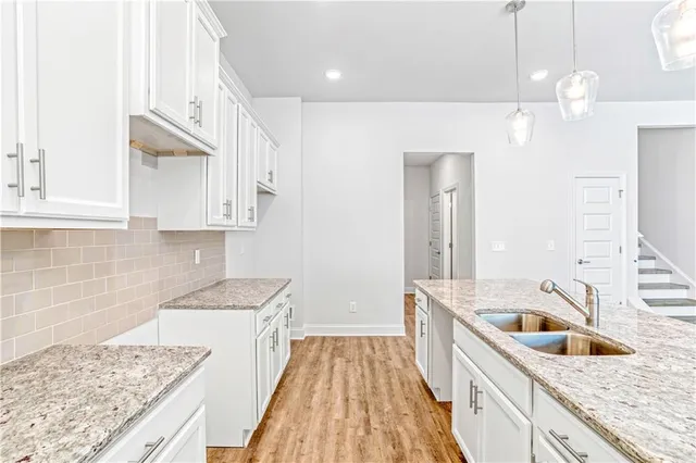 a bathroom with a sink a vanity and a mirror
