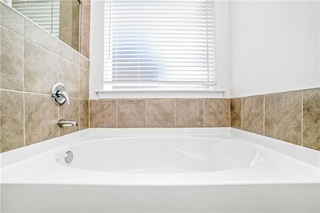 a bathroom with a sink double vanity and a mirror