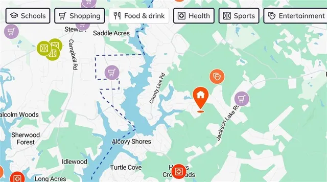 a white toilet sitting next to a white sink