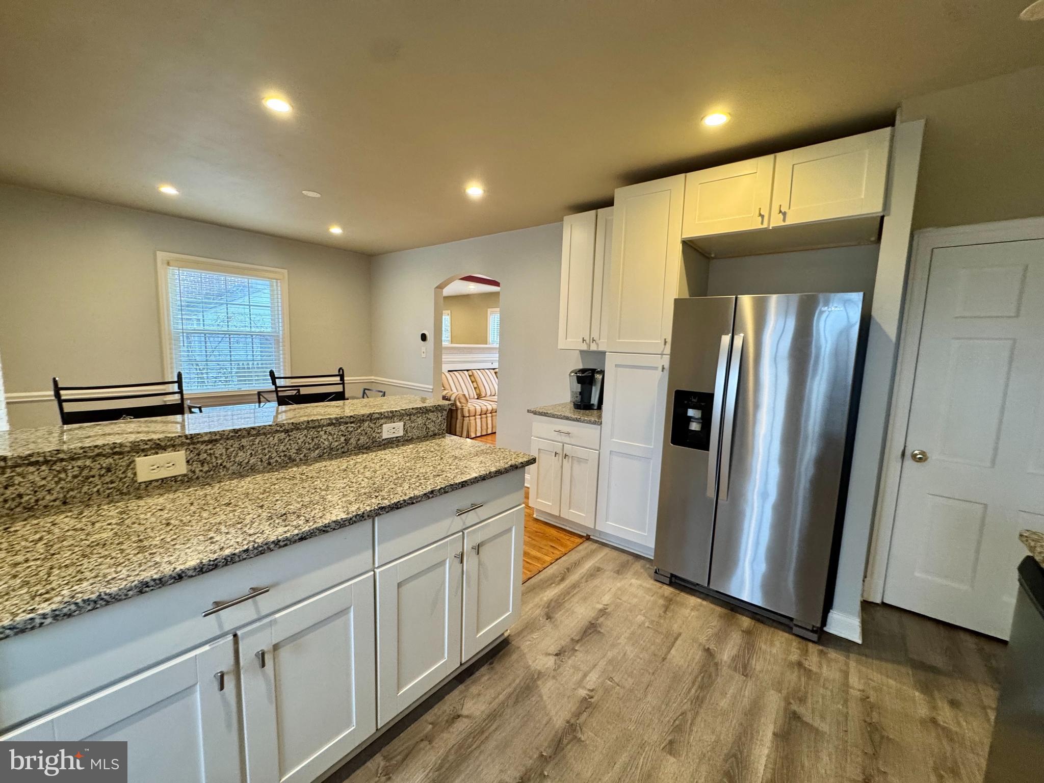 8815 Reading Road Silver Spring, MD 20901 - Photo 13 of 56 a kitchen with stainless steel appliances granite countertop a refrigerator and a sink