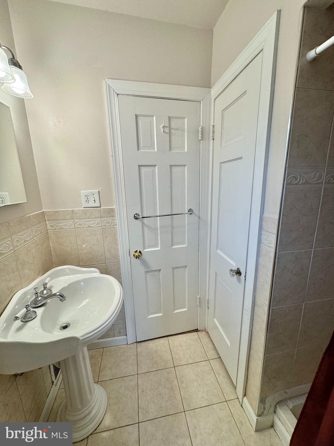 8815 Reading Road Silver Spring, MD 20901 - Photo 23 of 56 a bathroom with a sink a toilet and shower