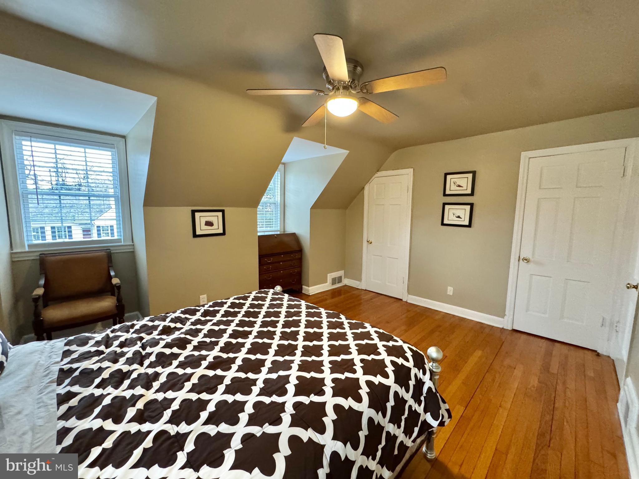 8815 Reading Road Silver Spring, MD 20901 - Photo 31 of 56 a bedroom with a bed and wooden floor