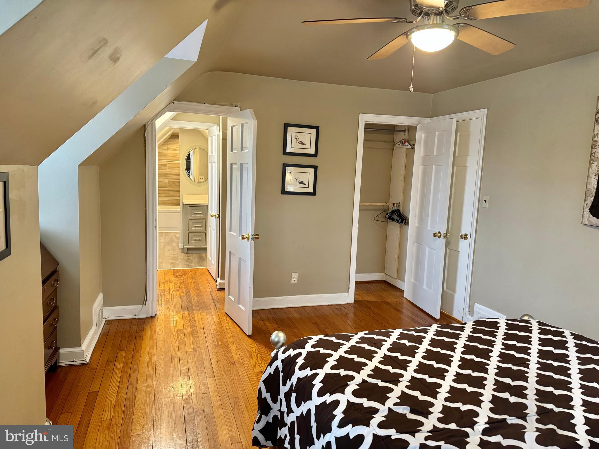 8815 Reading Road Silver Spring, MD 20901 - Photo 32 of 56 a bedroom with a bed and a walk in closet