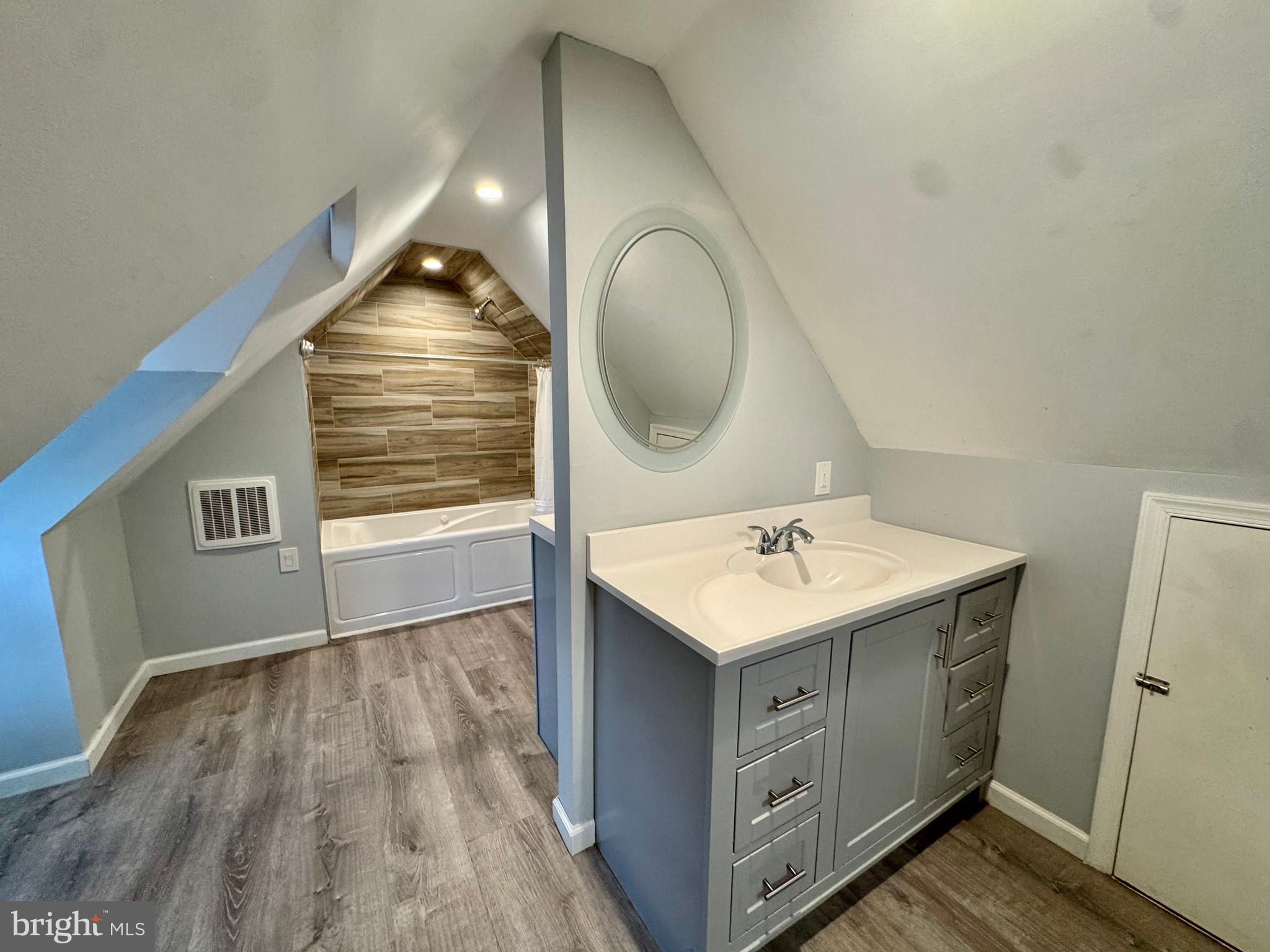 8815 Reading Road Silver Spring, MD 20901 - Photo 35 of 56 a bathroom with a sink and a mirror