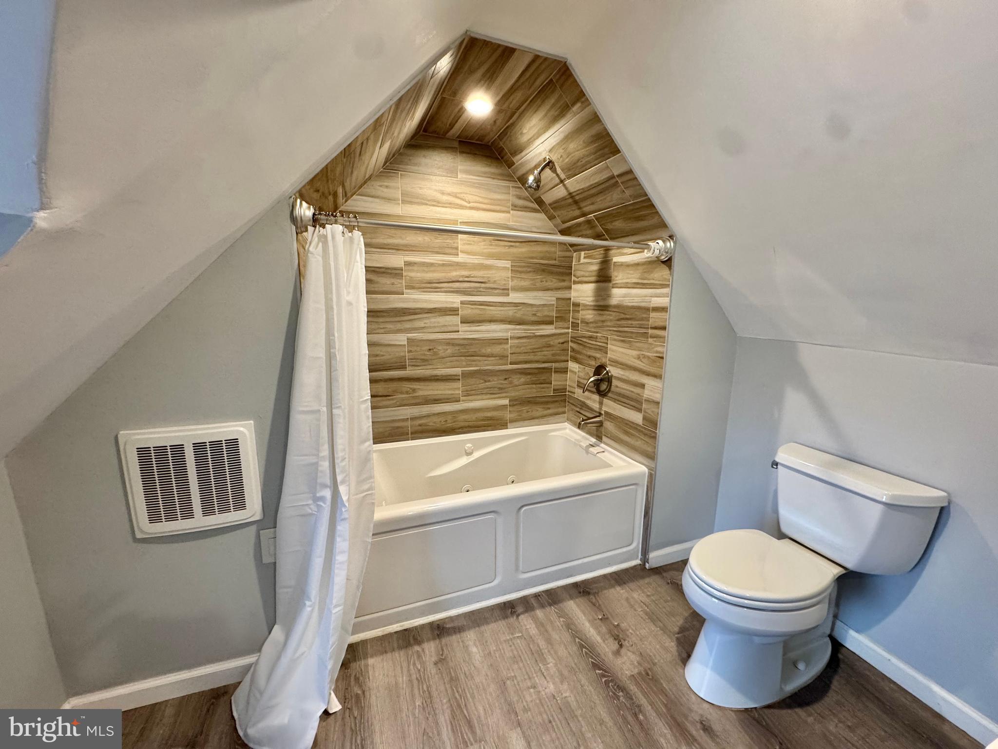 8815 Reading Road Silver Spring, MD 20901 - Photo 36 of 56 a bathroom with a toilet sink and a mirror