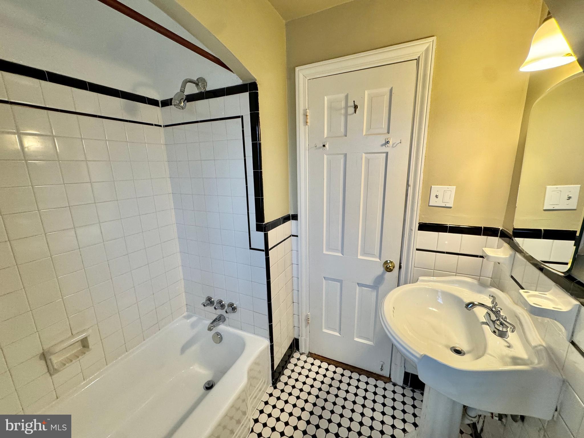 8815 Reading Road Silver Spring, MD 20901 - Photo 40 of 56 a bathroom with a sink a toilet and shower
