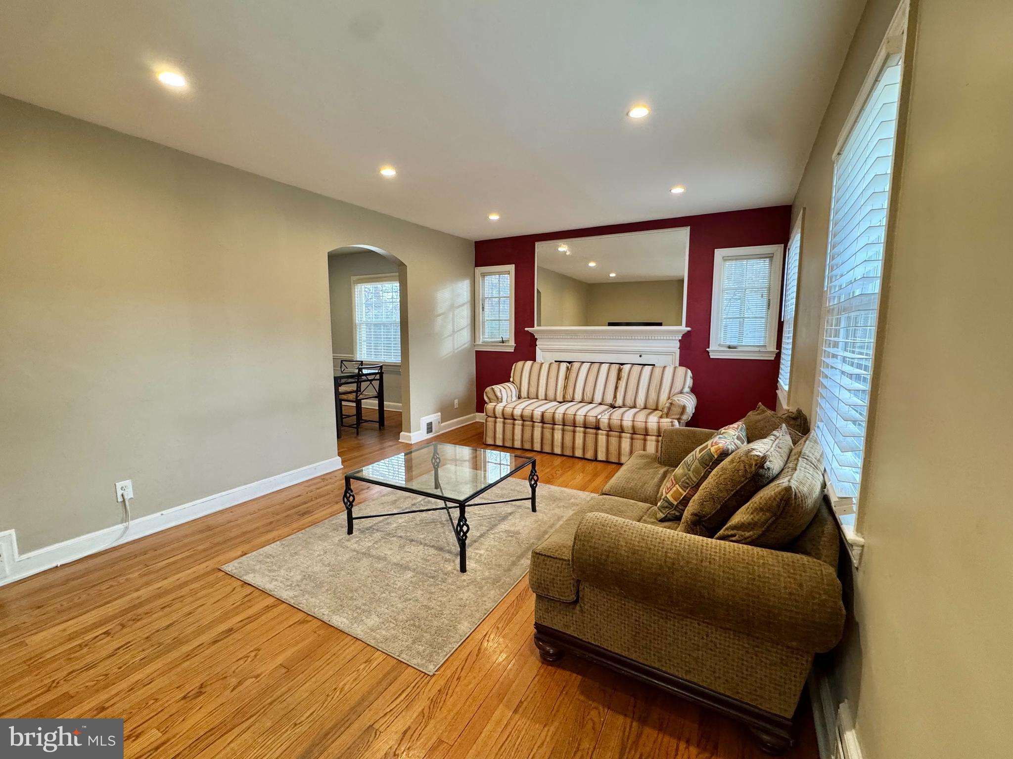 8815 Reading Road Silver Spring, MD 20901 - Photo 6 of 56 a living room with furniture and a wooden floor