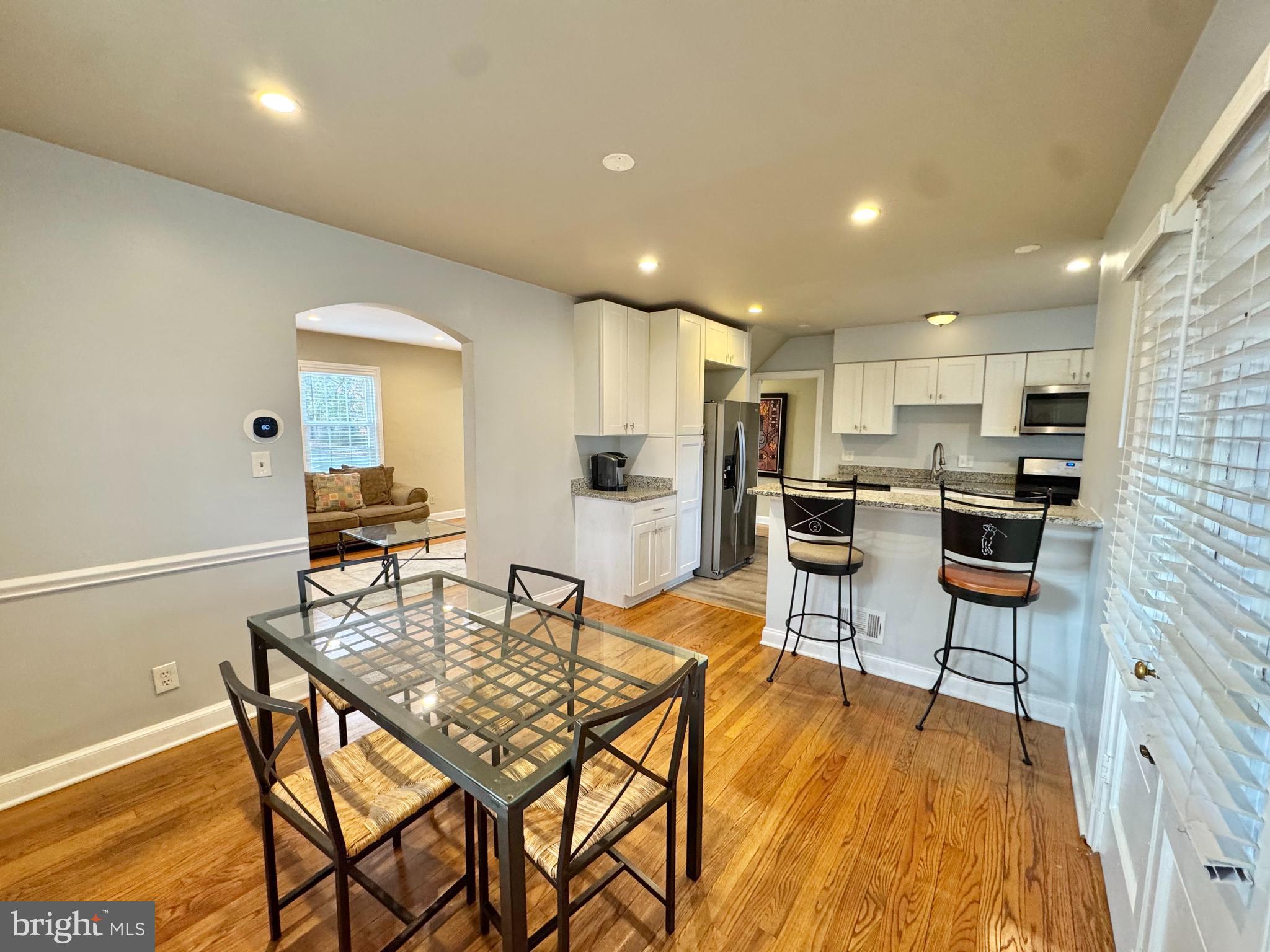 8815 Reading Road Silver Spring, MD 20901 - Photo 8 of 56 a kitchen with a table and chairs in it