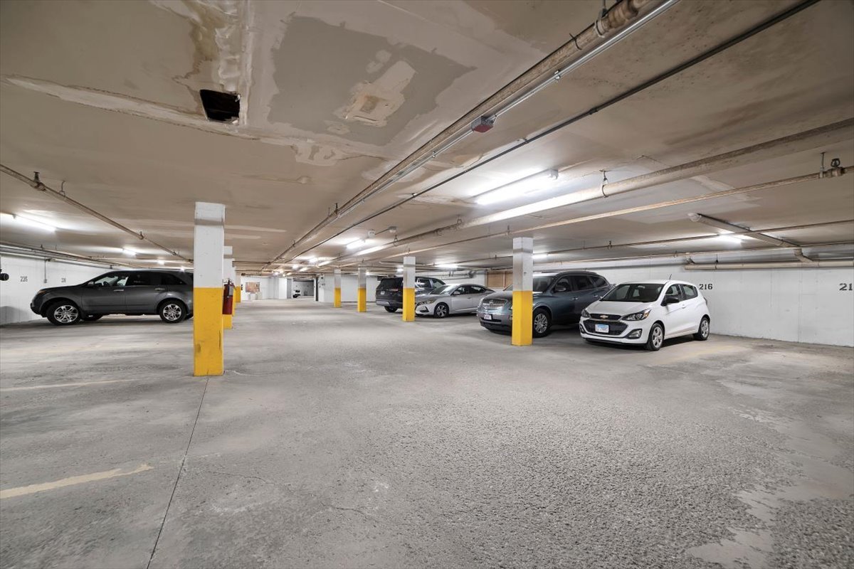 500 West Huntington Commons Road, Unit 448 Mount Prospect, IL 60056 - Photo 22 of 26 a view of parking area with parked cars