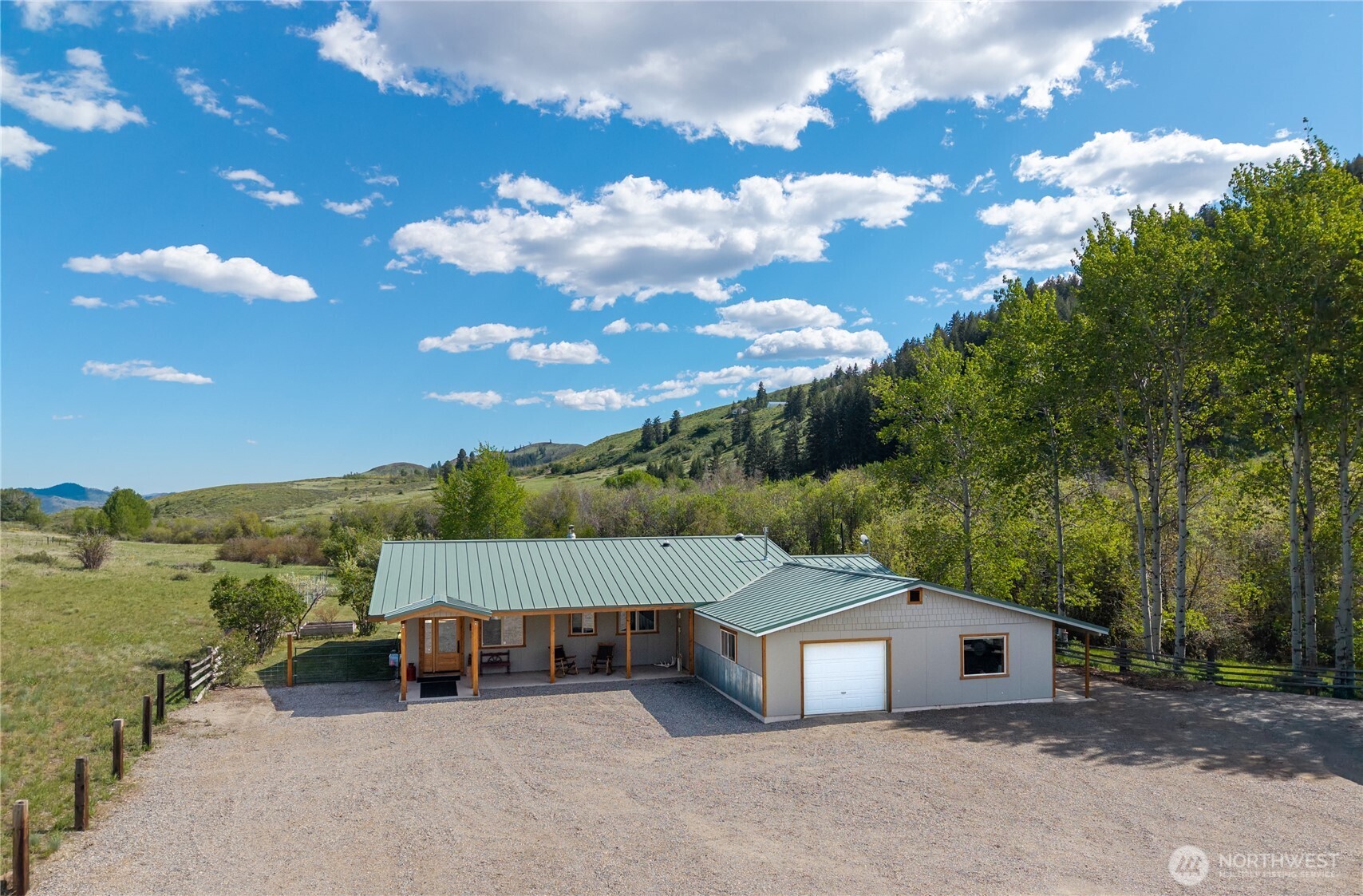 446 Rendezvous Road Winthrop, WA 98862 - Photo 1 of 40 a view of a house with a yard