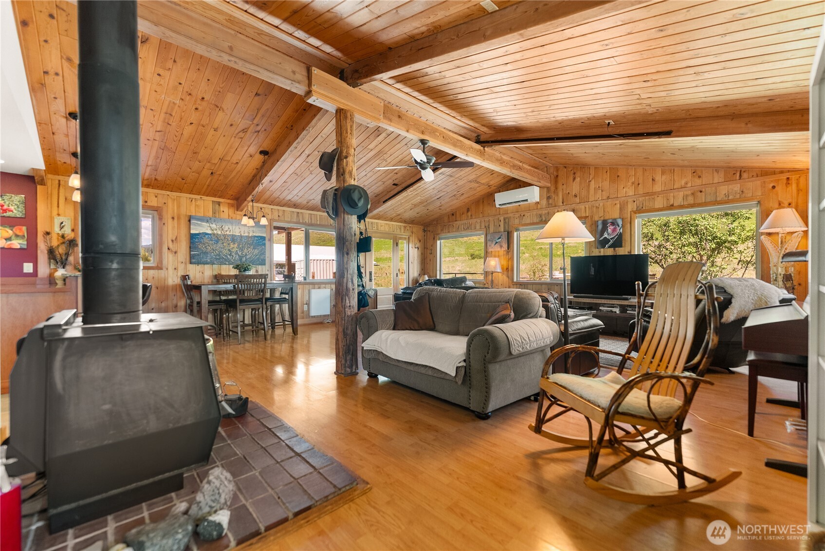 446 Rendezvous Road Winthrop, WA 98862 - Photo 12 of 40 a living room with furniture and a floor to ceiling window