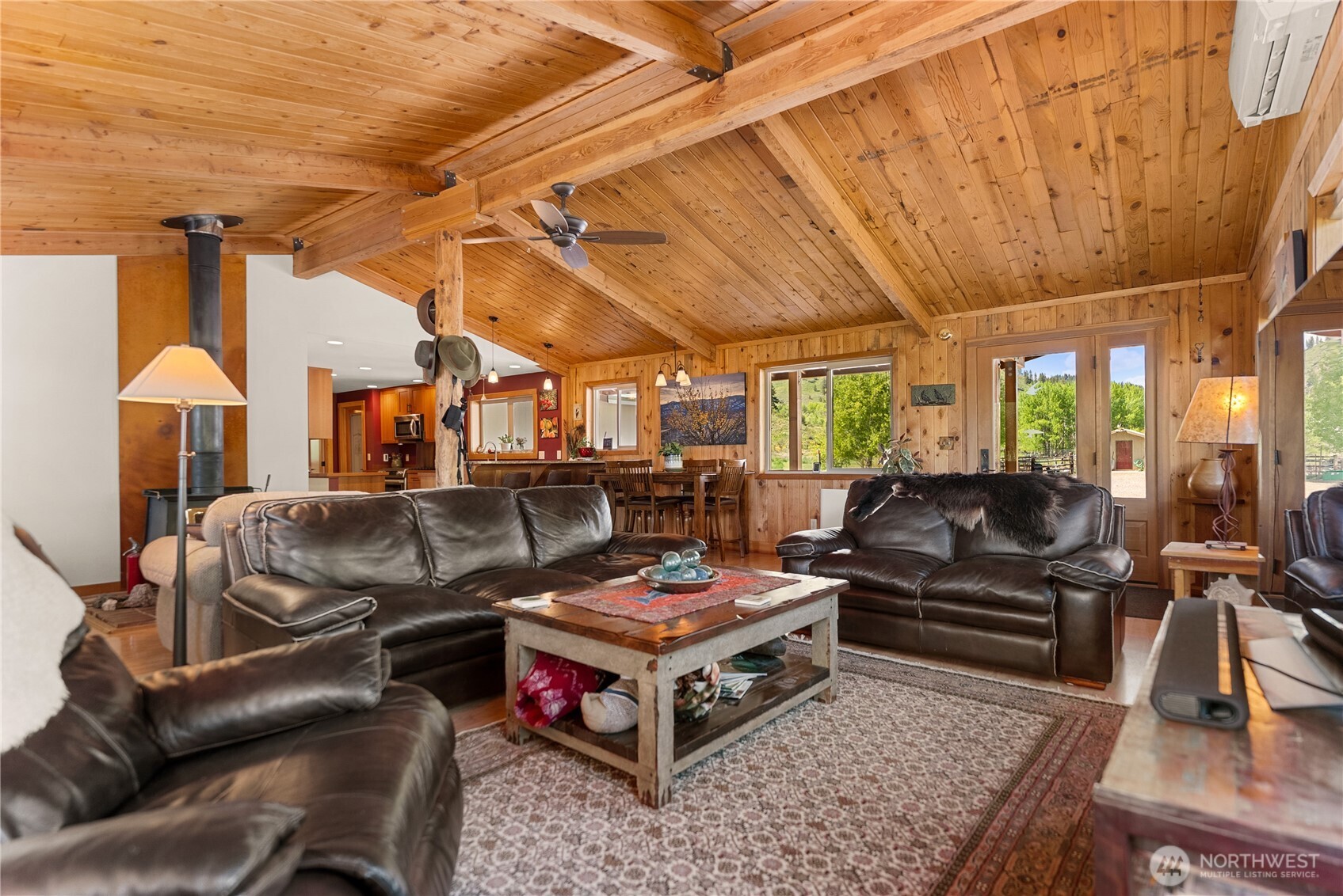 446 Rendezvous Road Winthrop, WA 98862 - Photo 13 of 40 a living room with furniture and a chandelier