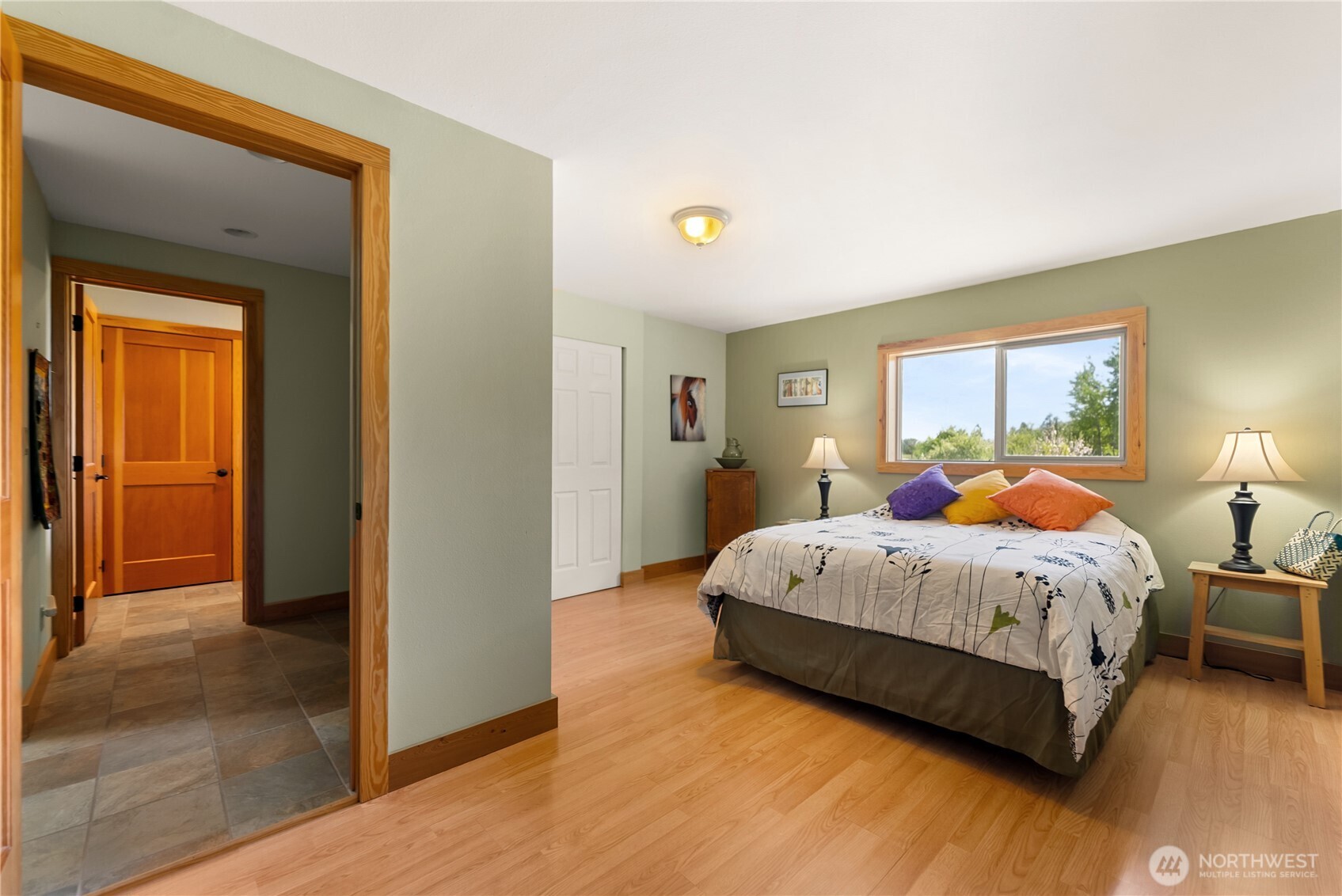 446 Rendezvous Road Winthrop, WA 98862 - Photo 20 of 40 a spacious bedroom with a bed and wooden floor
