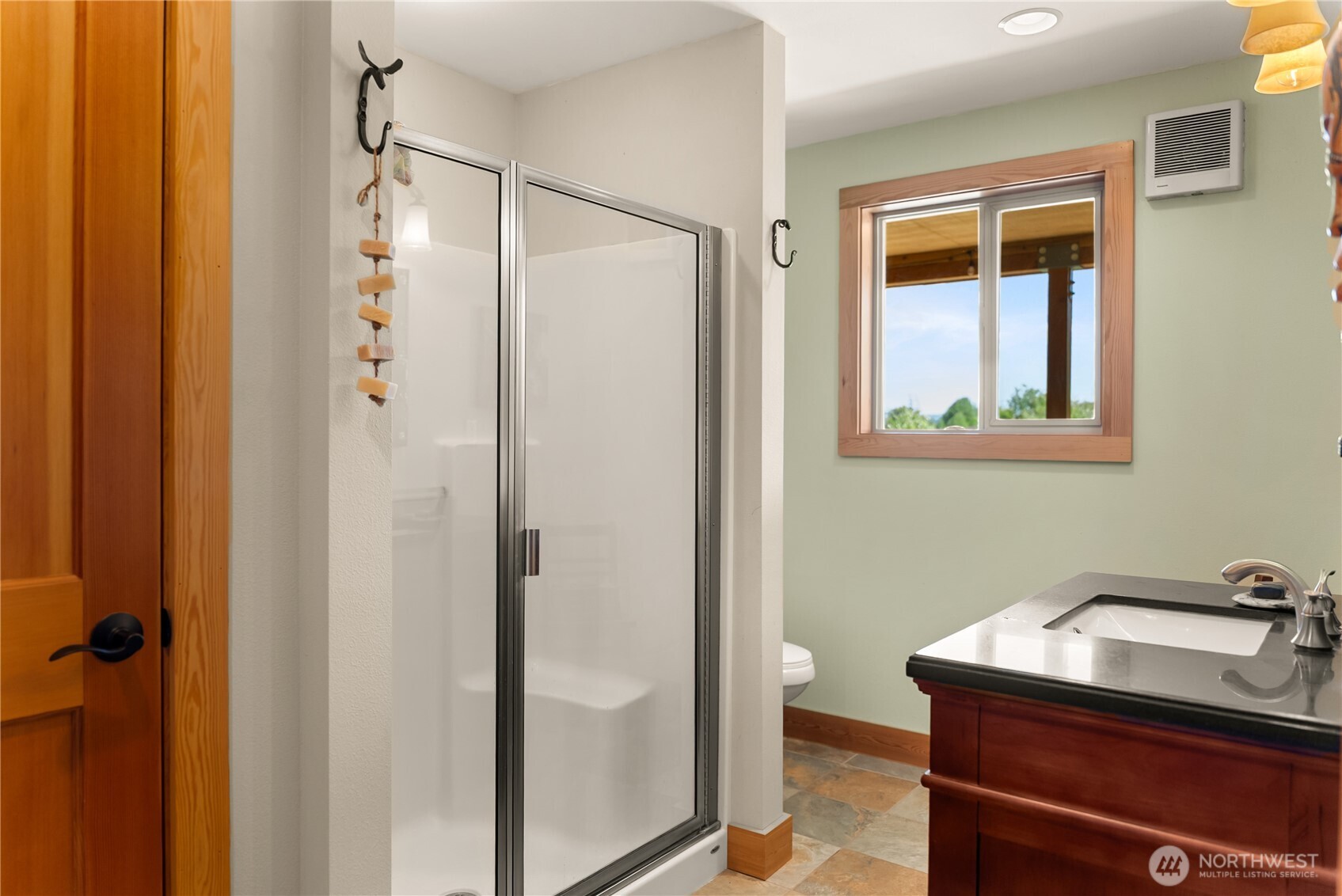 446 Rendezvous Road Winthrop, WA 98862 - Photo 22 of 40 a bathroom with a sink and a mirror