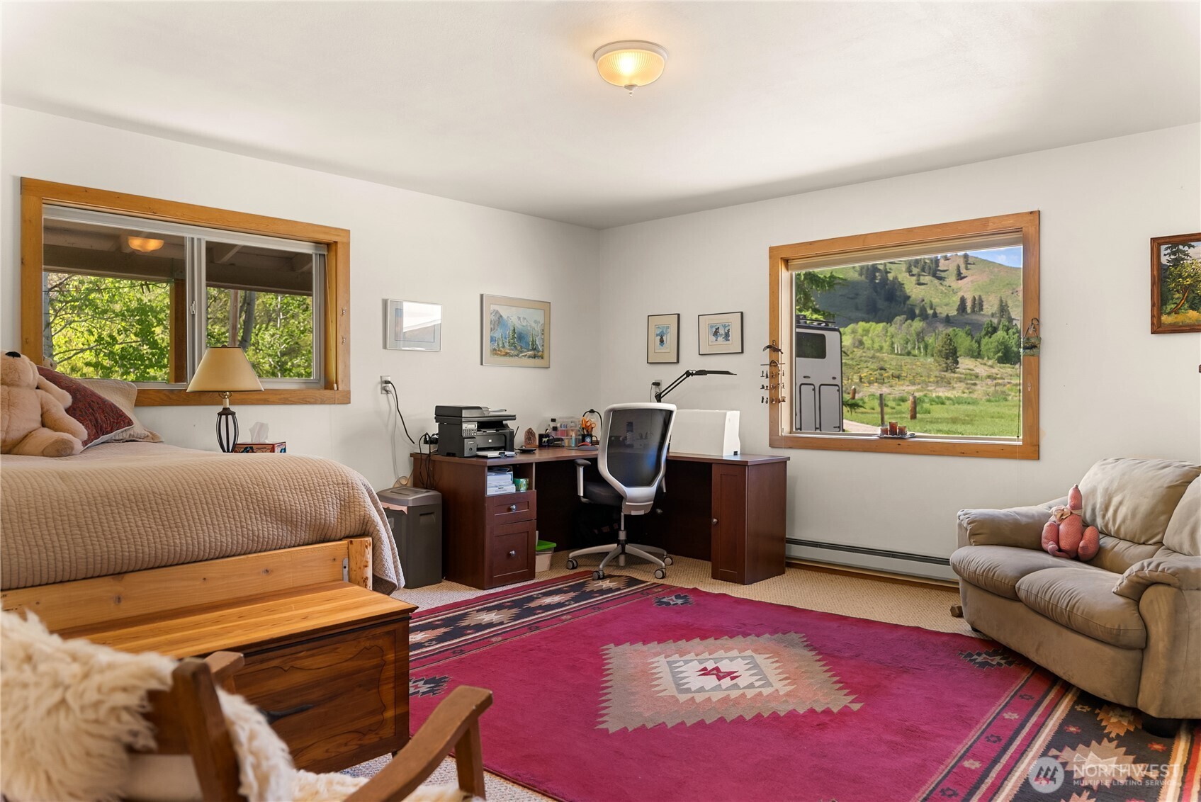 446 Rendezvous Road Winthrop, WA 98862 - Photo 26 of 40 a bedroom with a bed and wooden floor