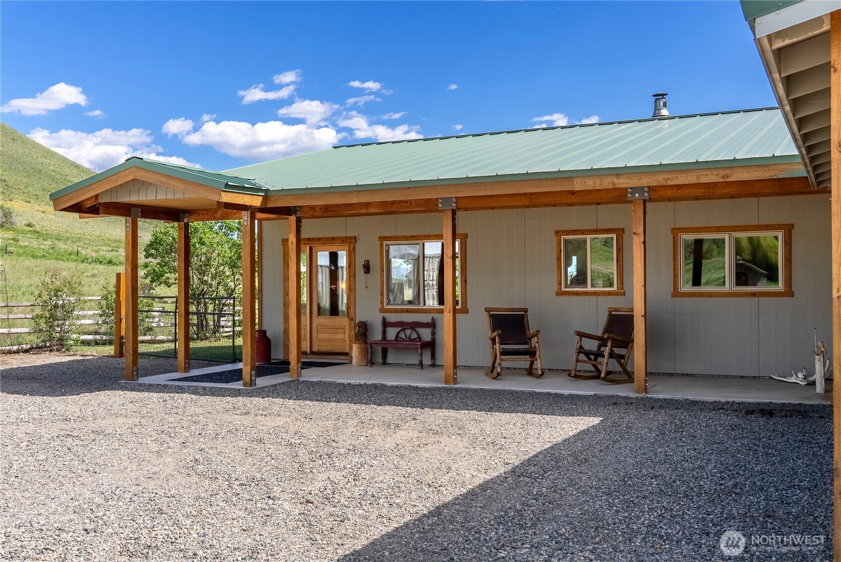 446 Rendezvous Road Winthrop, WA 98862 - Photo 3 of 40 a view of a house with backyard porch and sitting area