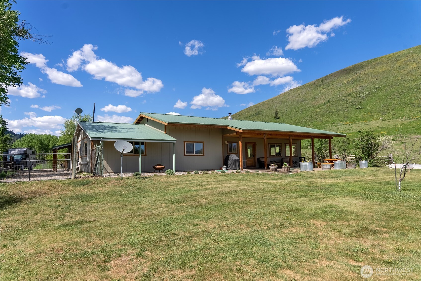 446 Rendezvous Road Winthrop, WA 98862 - Photo 32 of 40 a view of a house with a yard