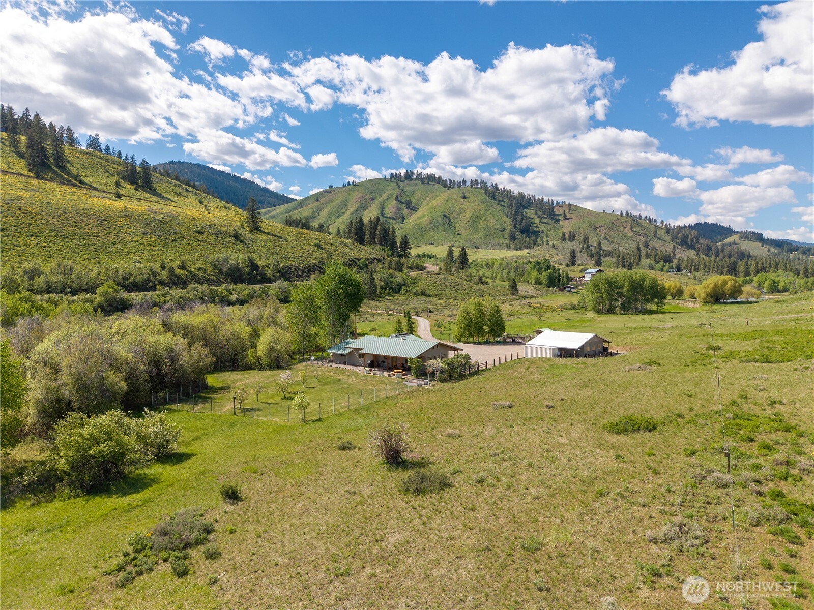 446 Rendezvous Road Winthrop, WA 98862 - Photo 37 of 40 a view of a lake with houses
