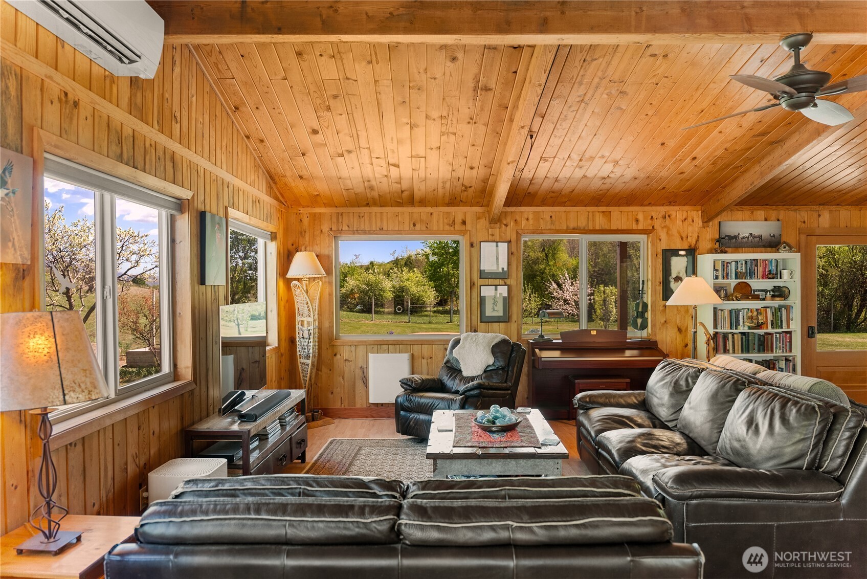 446 Rendezvous Road Winthrop, WA 98862 - Photo 9 of 40 a living room with furniture and a floor to ceiling window