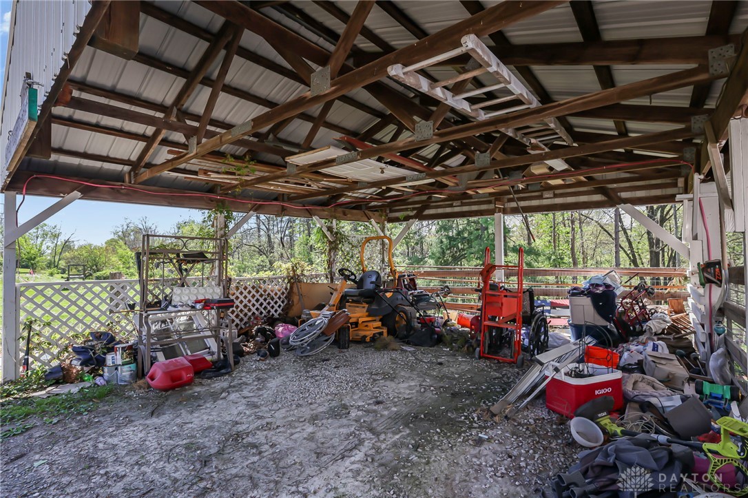 2390 Ridge Road Zanesville, OH 43701 - Photo 29 of 45 This spacious, covered outdoor area provides ample storage for equipment and tools.