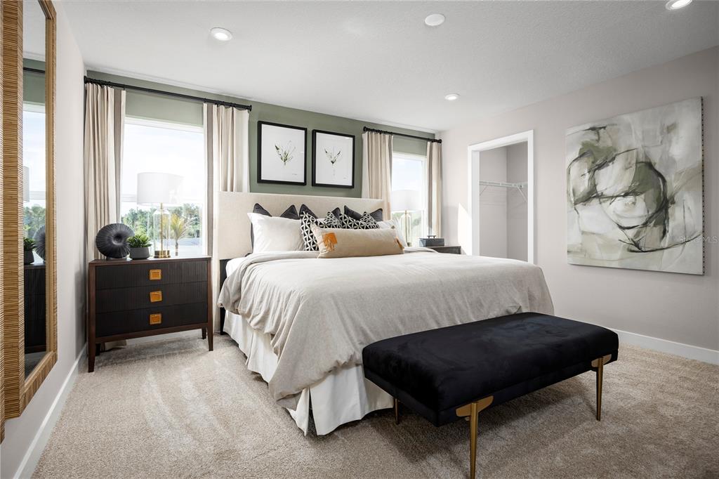 31590 Spanish Msn Road San Antonio, FL 33576 - Photo 11 of 26 a spacious bedroom with a bed and window