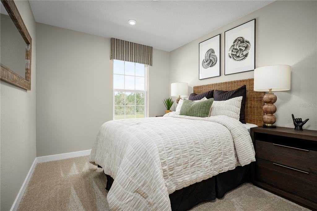 31590 Spanish Msn Road San Antonio, FL 33576 - Photo 12 of 26 a bedroom with a bed and window