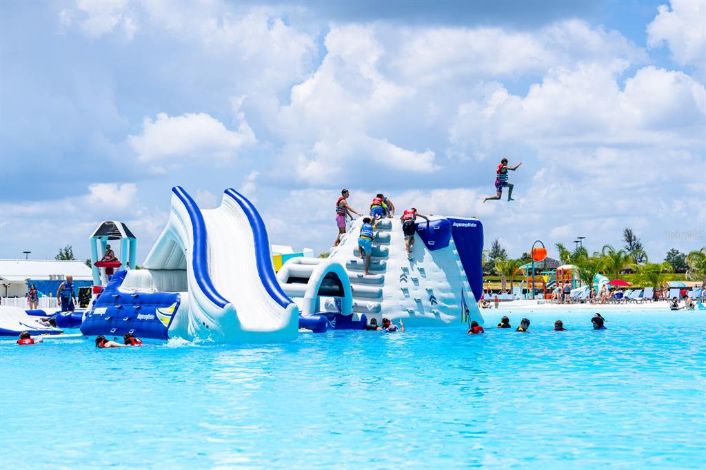 31590 Spanish Msn Road San Antonio, FL 33576 - Photo 23 of 26 a childrens park with lots of swings and slides and swimming pool