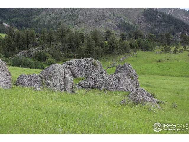 a upper view of a houses with a yard