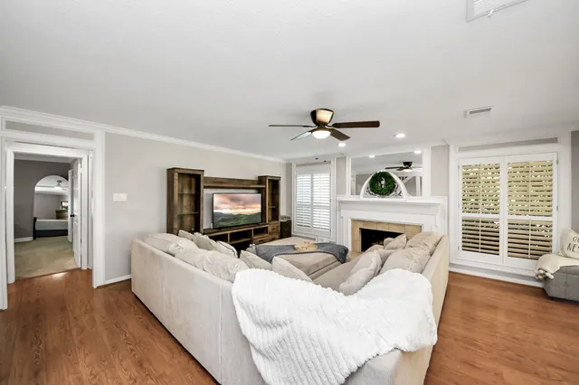 a view of walk in closet with clothes