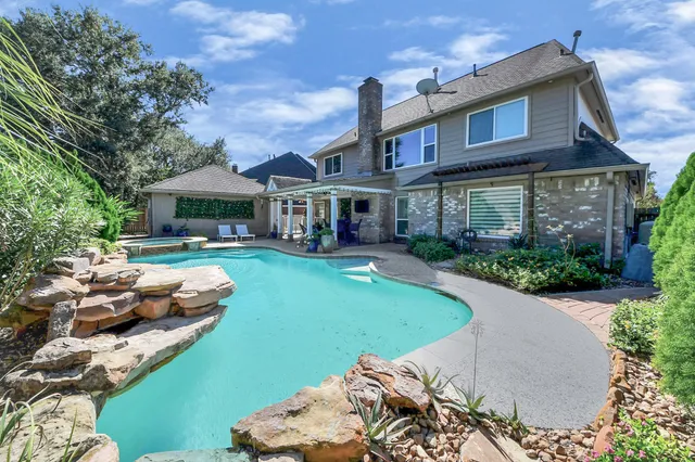 a view of a house with a chairs in patio