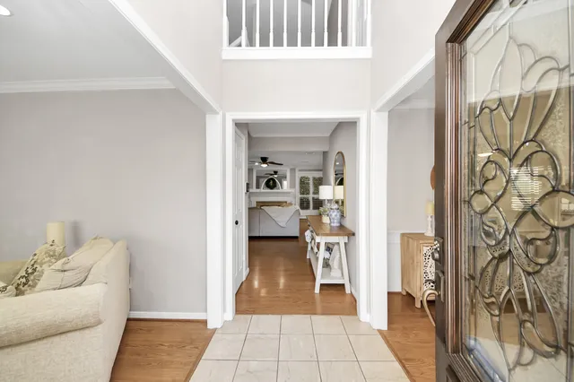 a large kitchen with granite countertop a sink stainless steel appliances and cabinets