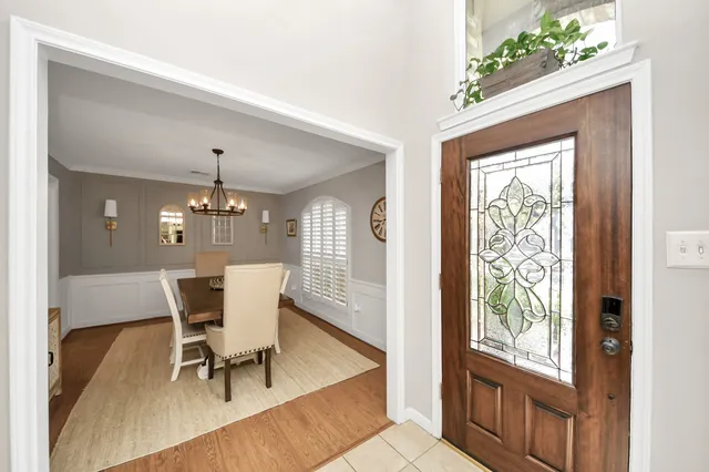 a bathroom with a sink mirror and toilet